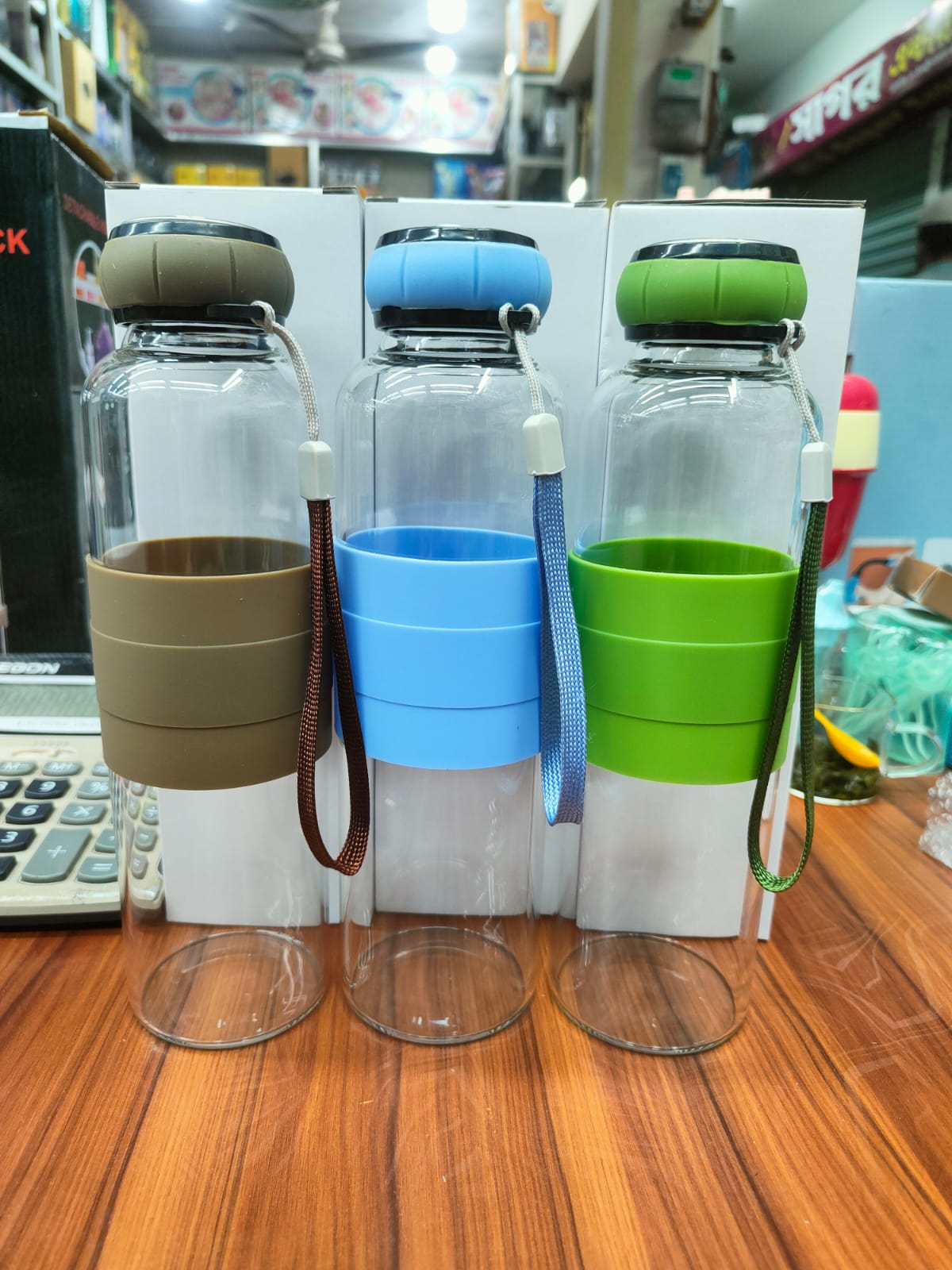 18181d3d-ae47-460c-a5de-fb9f143bc73b Leak-Proof Glass Water Bottle with Protective Silicone Grip & Strap - Image 1